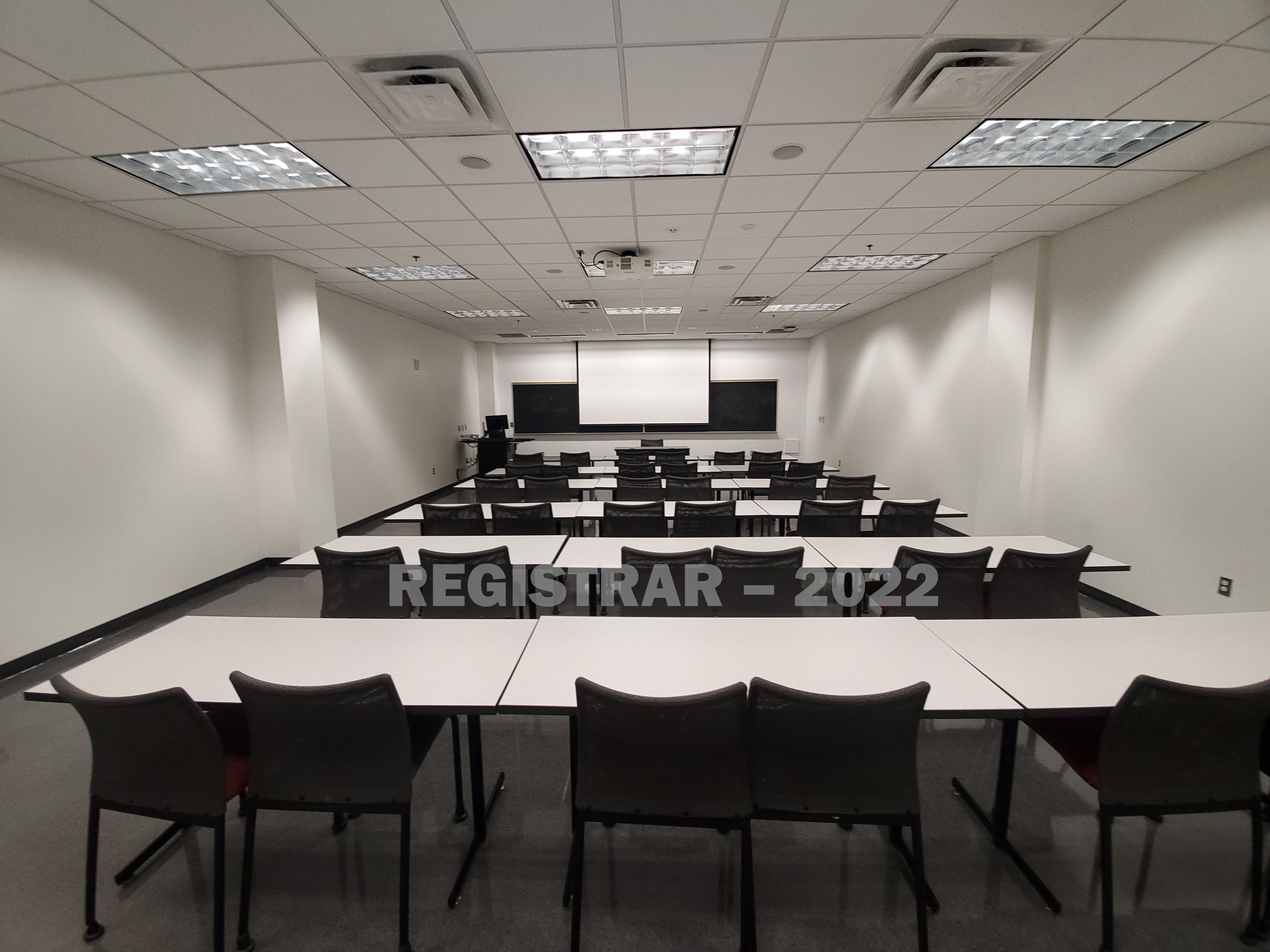 Scott Lab room North 56 ultra wide angle view from the back of the room with projector screen down
