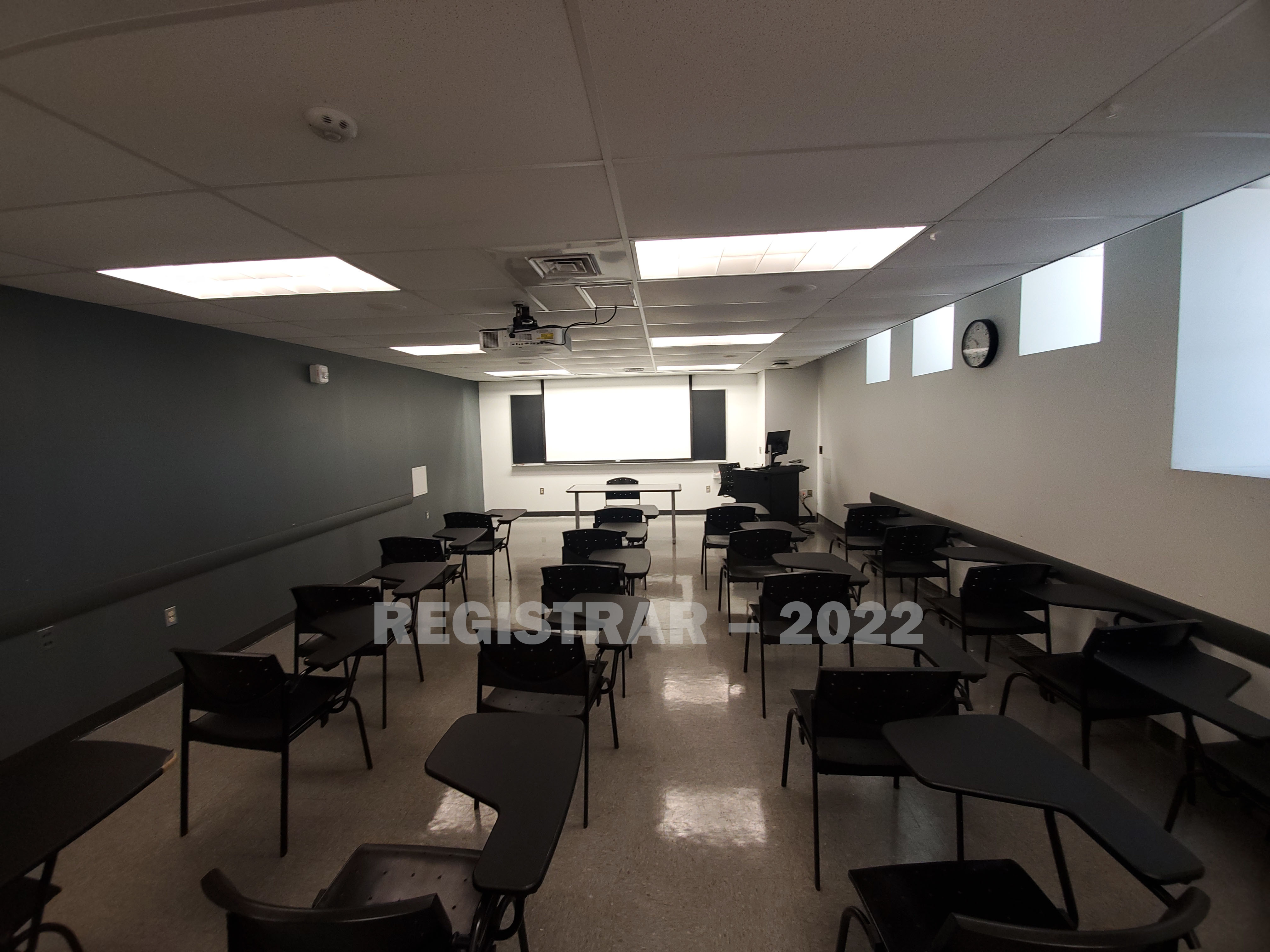 Hayes Hall room 12 ultra wide angle view from the back of the room with projector screen down