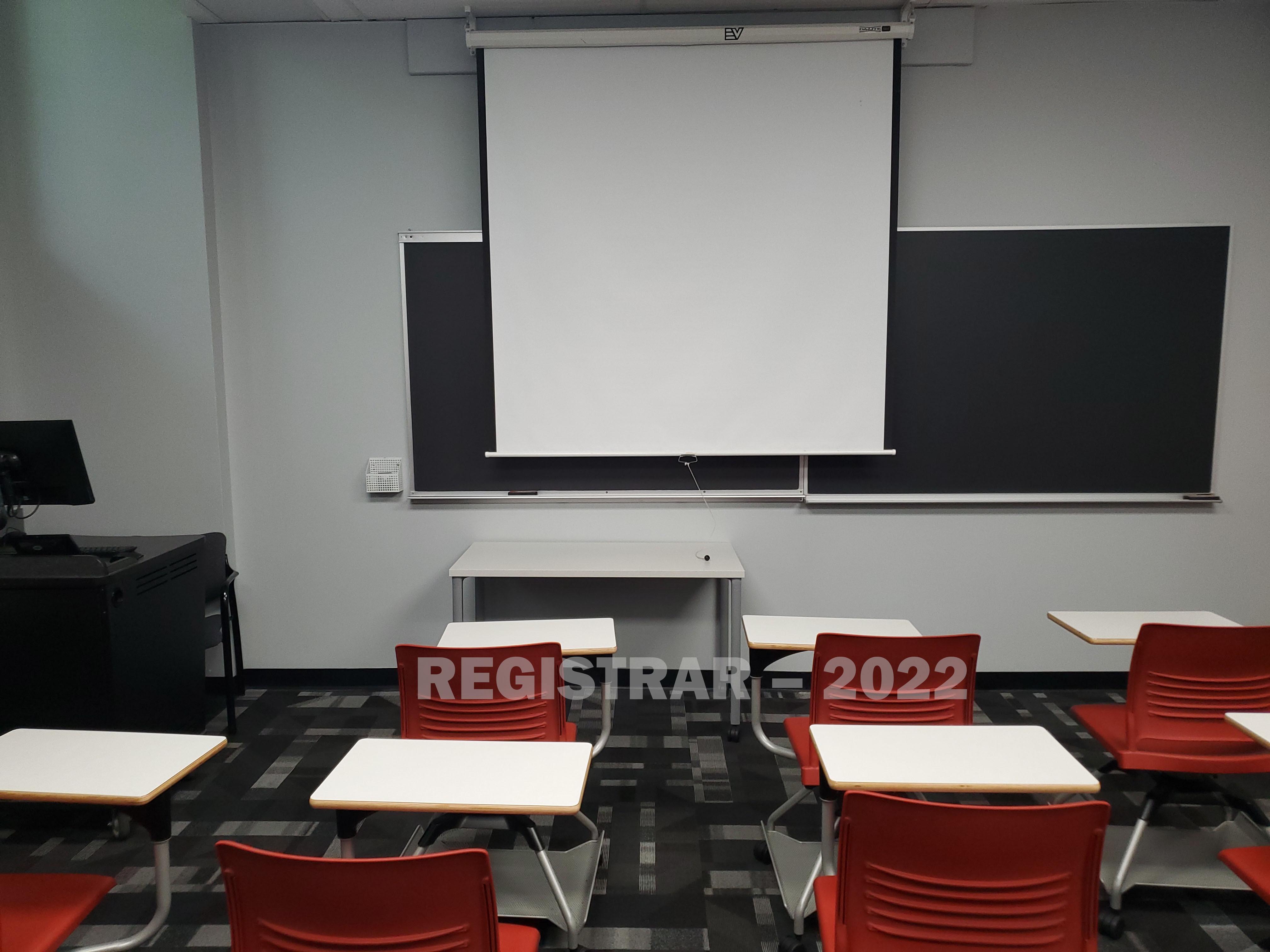 Derby Hall room 30 view from the back of the room with projector screen down